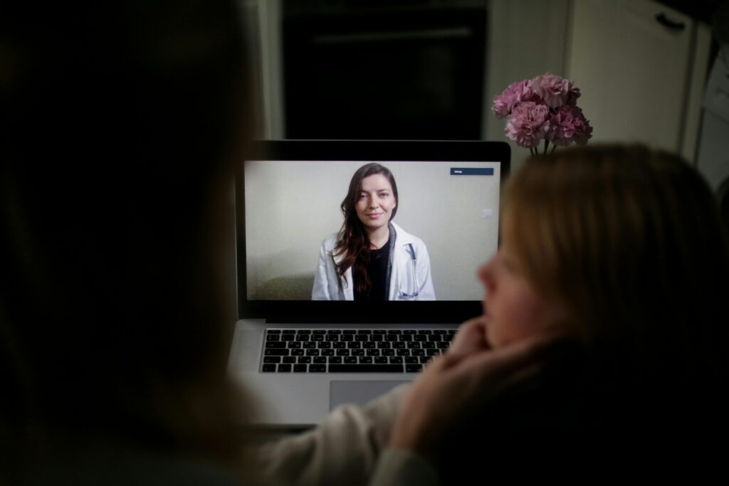 Telemedicine consultation connecting hospital patient with remote physician via virtual care platform